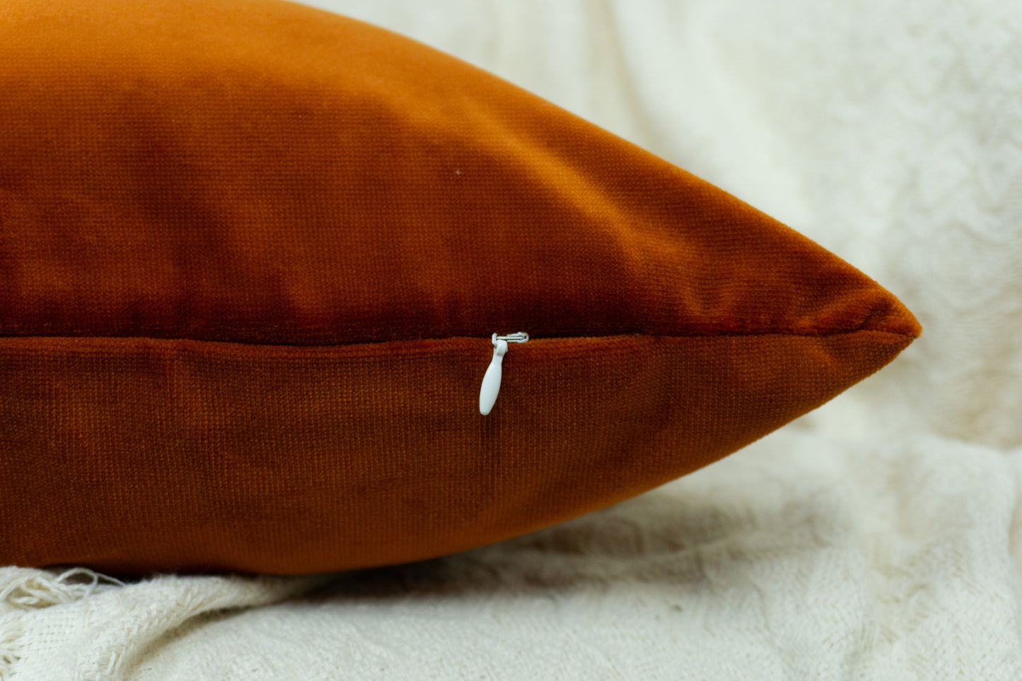 a close up of a pillow on a bed